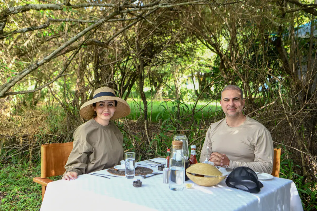 enjoying meal on an outdoor setup at enkakenya mara camp